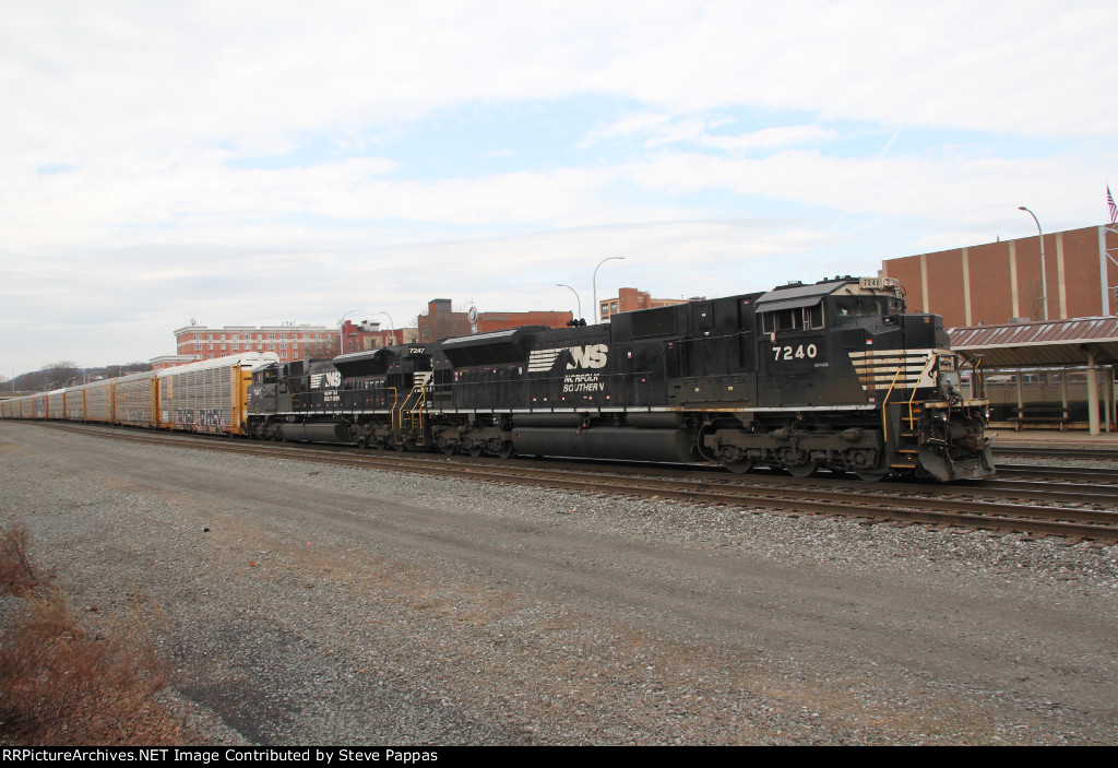 NS 7240 and 7347 lead a train east